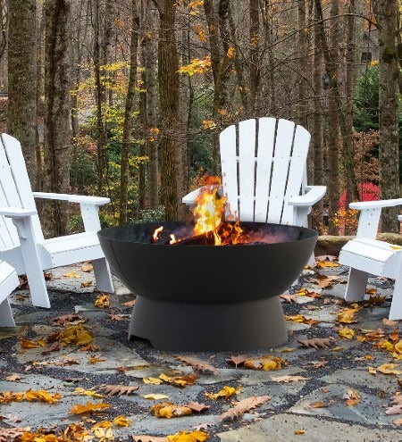 Castworks Hergóm Meteor low base fire pit complete outdoor fireplace set with black metal construction and fire bowl.