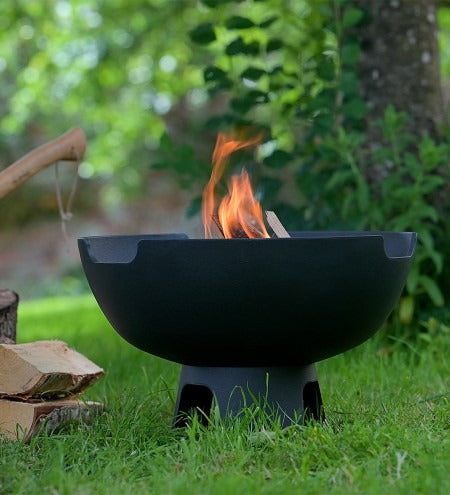 Castworks Hergóm Meteor Low Base Fire Pit for outdoor fireplaces with a sleek metal design and sturdy low base.